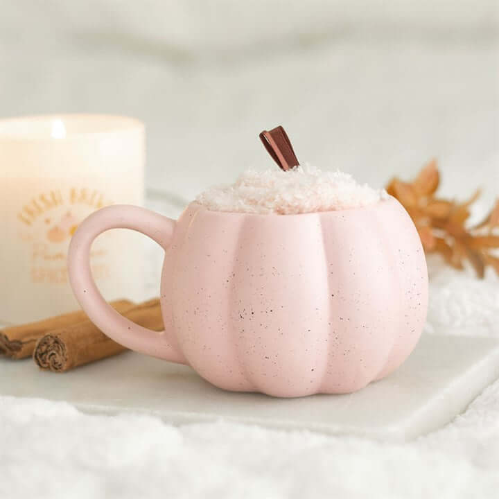 Pink Pumpkin Mug and Socks Set featuring a cute pink pumpkin mug with whipped cream and a cinnamon stick.