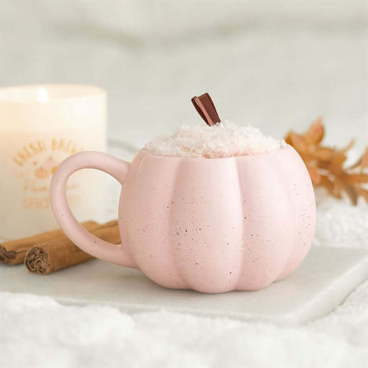Pink Pumpkin Mug and Socks Set featuring a cute pink pumpkin mug with whipped cream and a cinnamon stick.