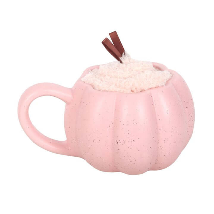 Pink pumpkin mug with a plush top, part of the Pink Pumpkin Mug and Socks Set, perfect for cozy mornings.