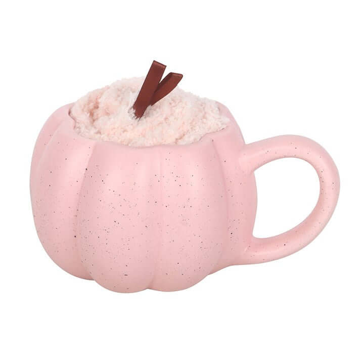 Pink pumpkin mug with soft texture and dark twig embellishment, perfect for cozy drinks in a Mug and Socks Set.
