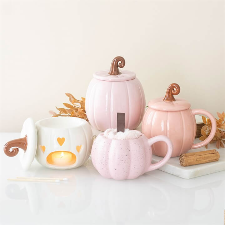 Pink Pumpkin Mug and Socks Set featuring four decorative mugs in pastel colors with pumpkin designs.
