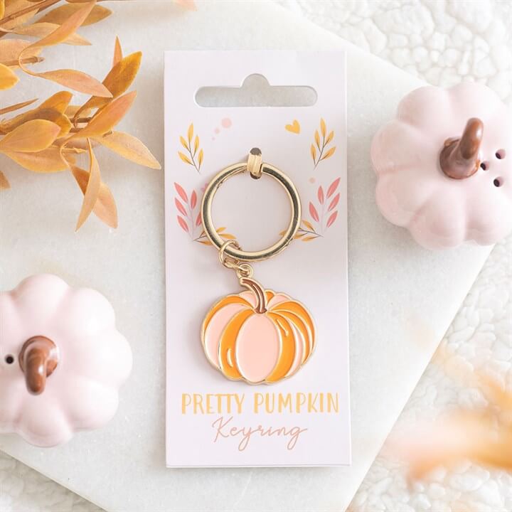 Add a soft and stylish autumn touch to your everyday essentials with this Pretty Pumpkin Keyring. Featuring a charming pumpkin design in delicate pink and orange tones, this accessory brings a subtle seasonal feel that’s both cute and versatile. Perfect f