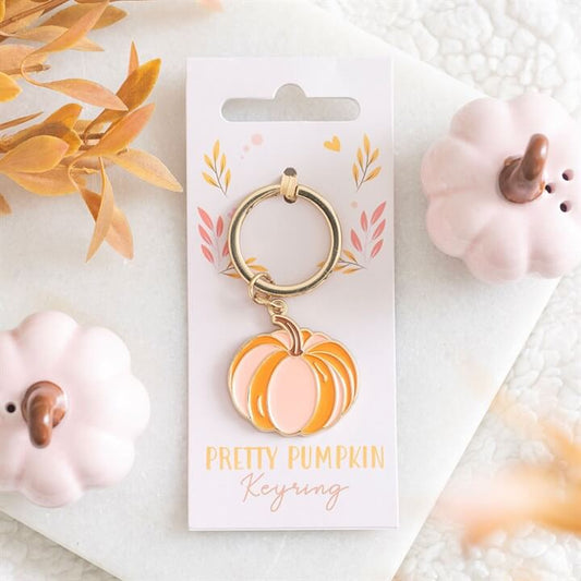 Add a soft and stylish autumn touch to your everyday essentials with this Pretty Pumpkin Keyring. Featuring a charming pumpkin design in delicate pink and orange tones, this accessory brings a subtle seasonal feel that’s both cute and versatile. Perfect f