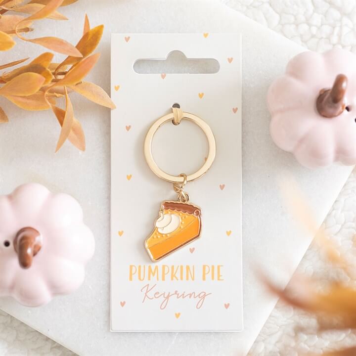 Add a sweet touch of autumn to your everyday essentials with this Pumpkin Pie Keyring. Designed to look like a delicious slice of pumpkin pie, this charming accessory is perfect for celebrating the cosy vibes of the season. Clip it onto your keys, handbag