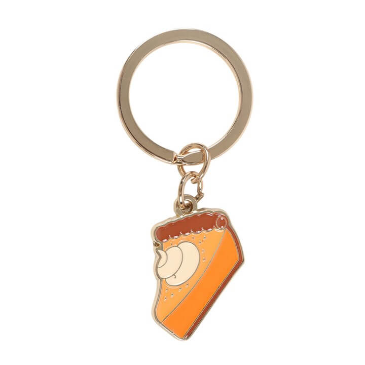 Add a sweet touch of autumn to your everyday essentials with this Pumpkin Pie Keyring. Designed to look like a delicious slice of pumpkin pie, this charming accessory is perfect for celebrating the cosy vibes of the season. Clip it onto your keys, handbag