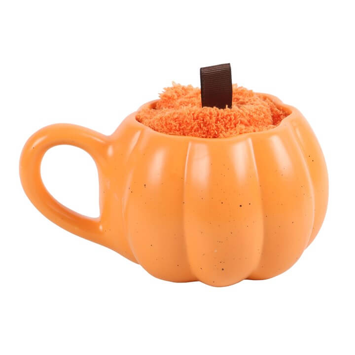 Pumpkin Shaped Mug and Socks Set featuring a sculpted pumpkin mug filled with fluffy orange socks.