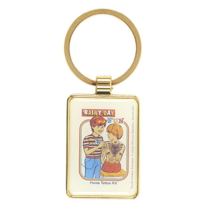 Keychain with cartoon design of two people and text on a white background