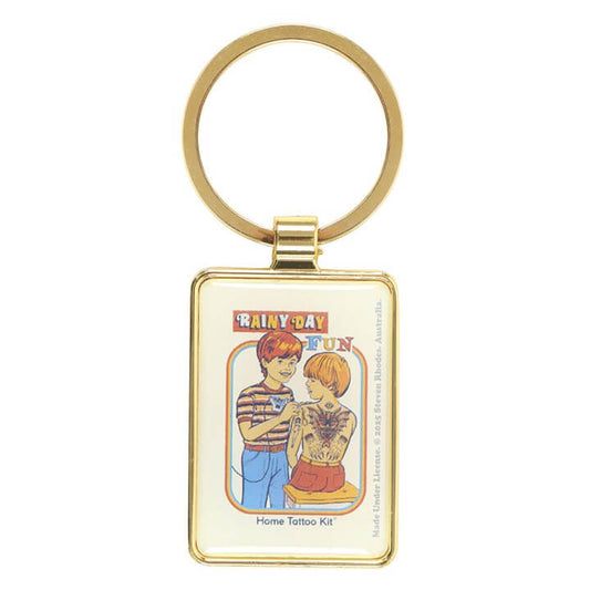 Keychain with cartoon design of two people and text on a white background