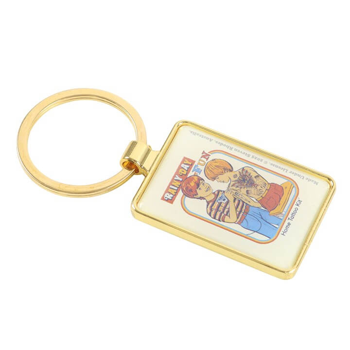 Gold keychain with a colorful design on a white background