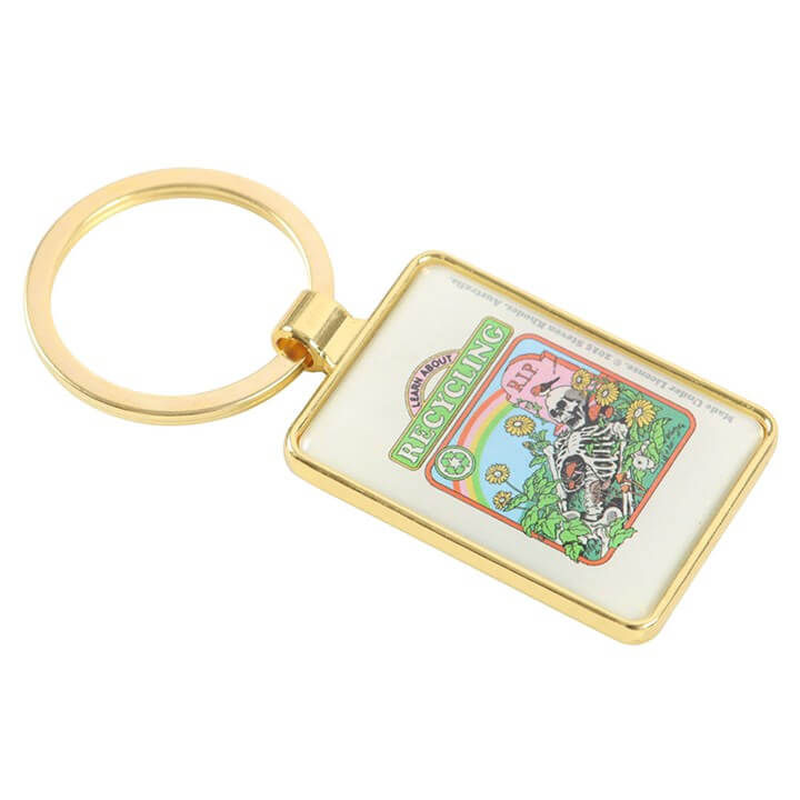 Keychain with a colorful design featuring a skeleton and recycling symbol on a white background