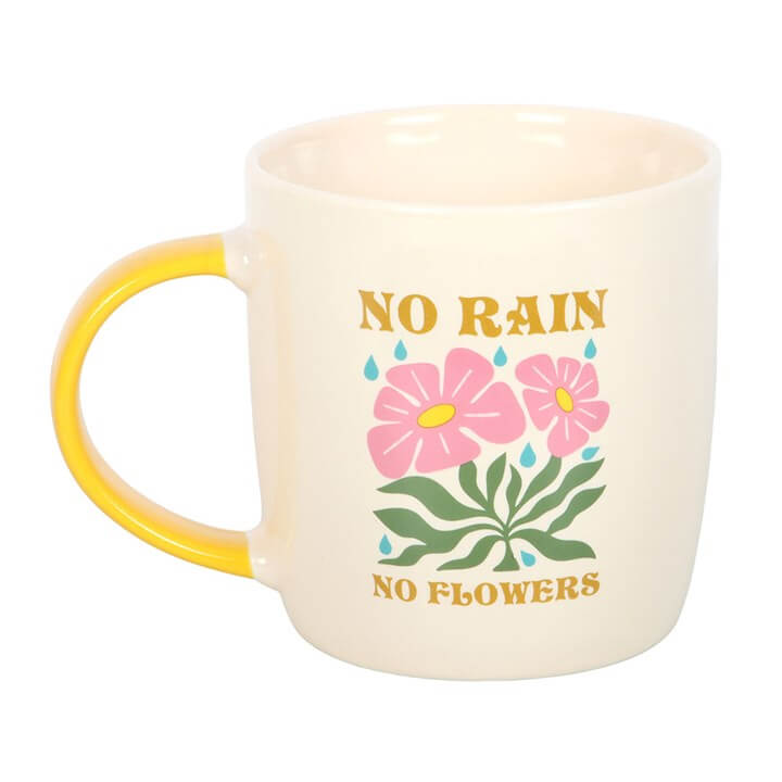 Cute No Rain, No Flowers Mug with pink flowers design and cheerful yellow handle, perfect for positive mornings.