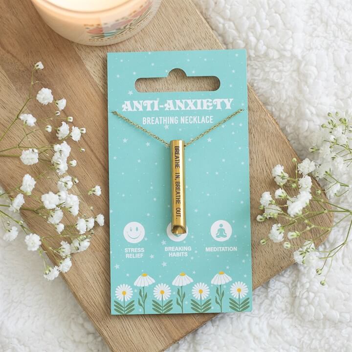 Rain or Shine Anti-Anxiety Breathing Necklace on a decorative card with flowers, promoting calm breathing and stress relief.
