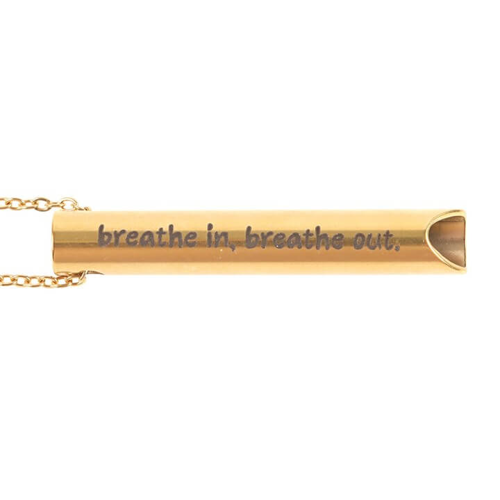 Breathing Necklace with gold tube pendant engraved with 'breathe in, breathe out' for calming mindfulness.