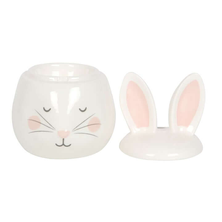 Ceramic jar with rabbit face design on a white background