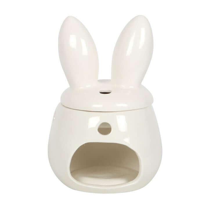 White ceramic oil diffuser shaped like a rabbit on a white background