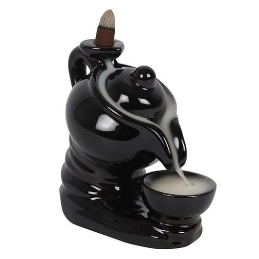 Black ceramic incense burner with a bowl and incense stick on a white background