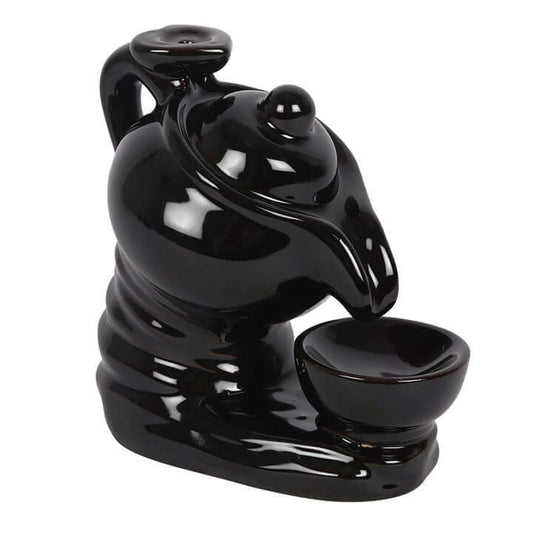 Black ceramic incense burner on a white background