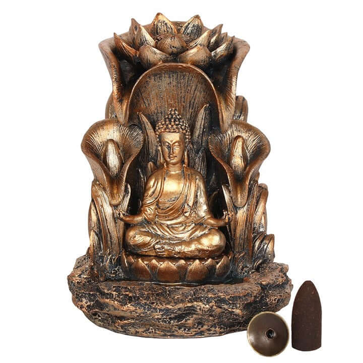 Bronze Buddha statue with lotus flowers and incense cones on a white background