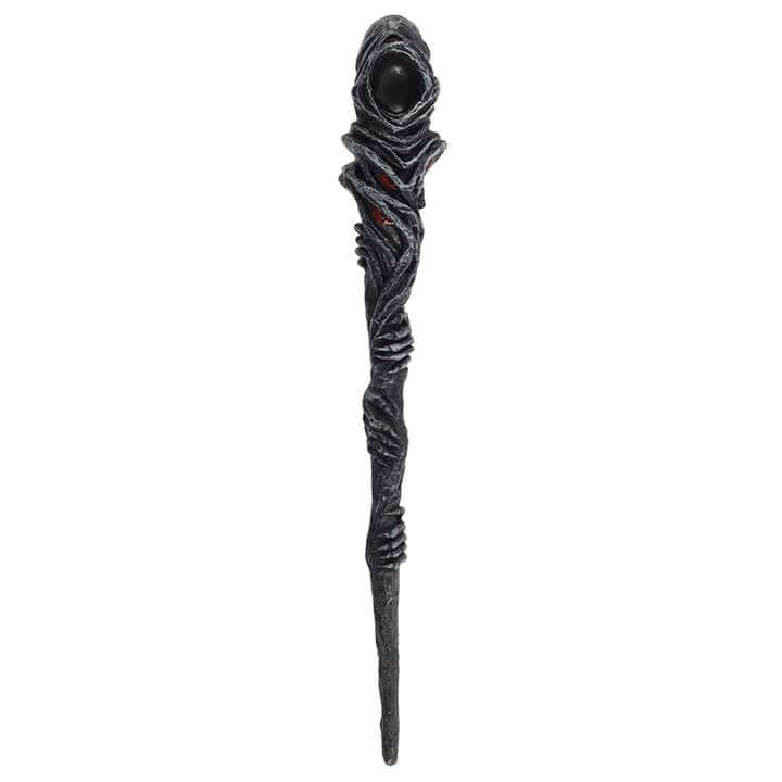 Decorative staff with textured design and dark sphere on a white background