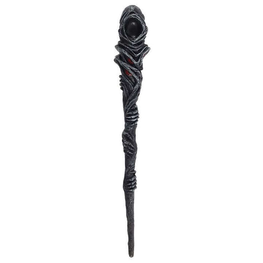 Decorative staff with textured design and dark sphere on a white background