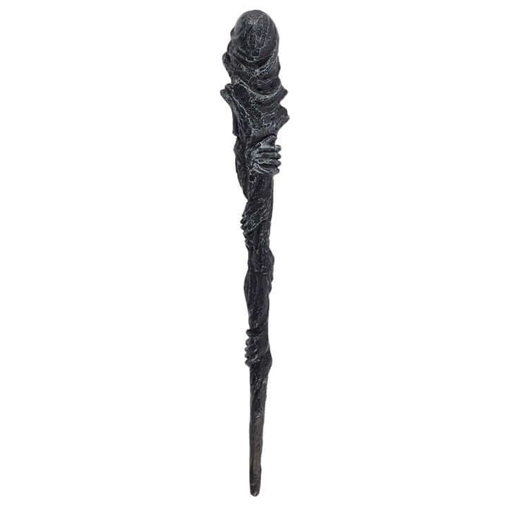 Decorative staff with intricate design on a white background