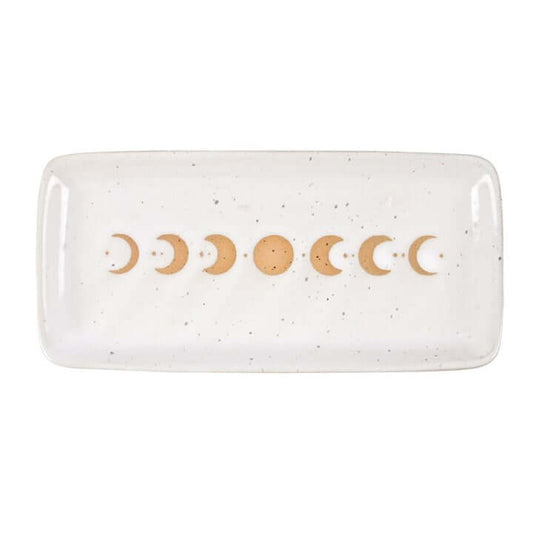 Rectangular ceramic dish with gold moon phases on a white background