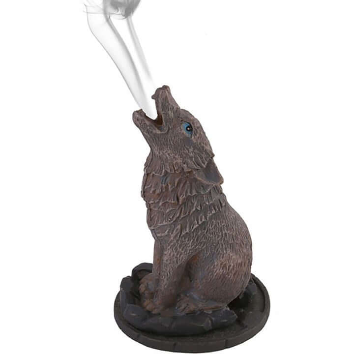 Wolf-shaped incense burner with smoke on a white background