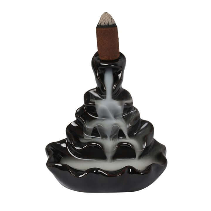 Black incense burner with a cone on a white background