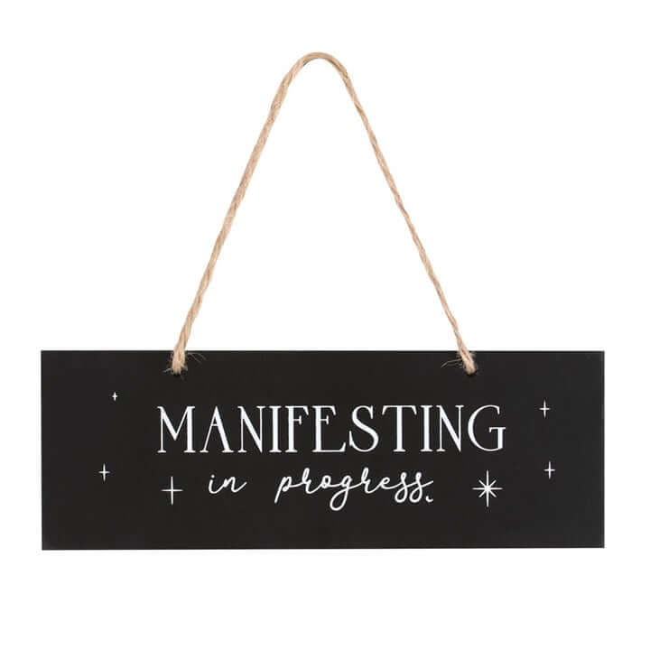 Hanging Sign displaying 'Manifesting in progress' for meditation and spellcasting decor.