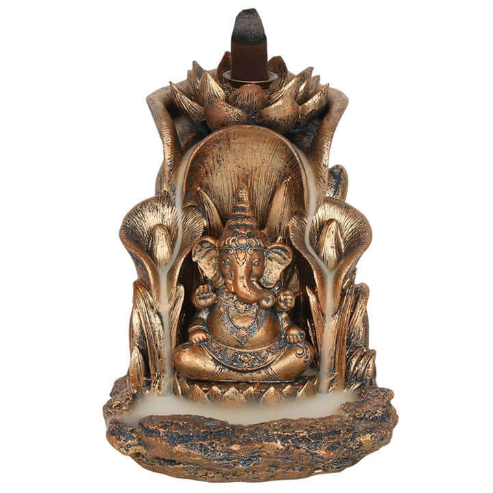 Decorative incense burner with a figure of Ganesha on a white background