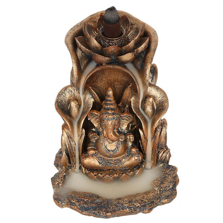 Decorative incense burner with Ganesha figure on a white background