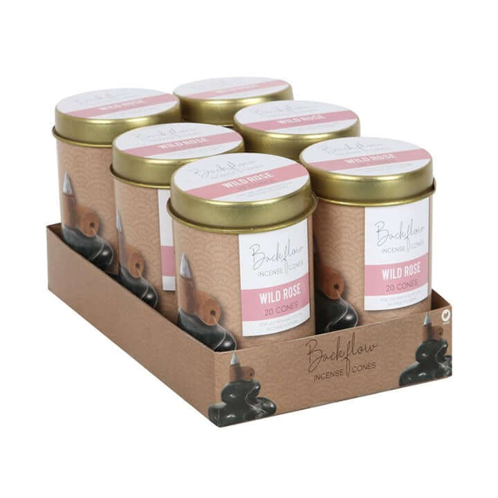 Packaging of Backflow Incense Cones with gold lids and pink labels on a white background