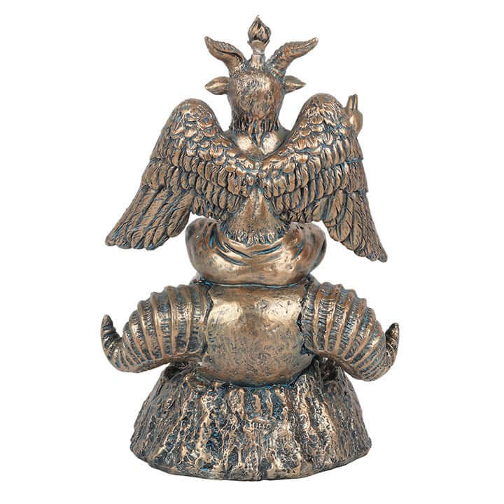 Bronze statue of a figure with wings on a white background