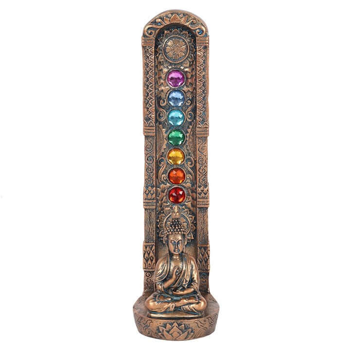 Decorative incense holder with seven colored stones and Buddha statue on a white background