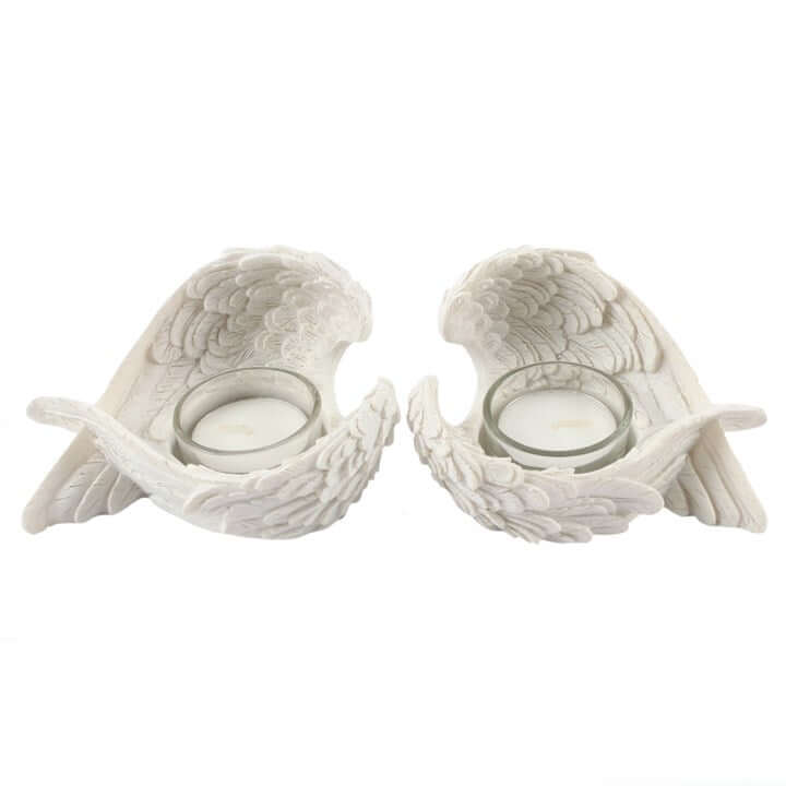 Set of 2 winged candle holders featuring white resin angel wings with tealight holders.