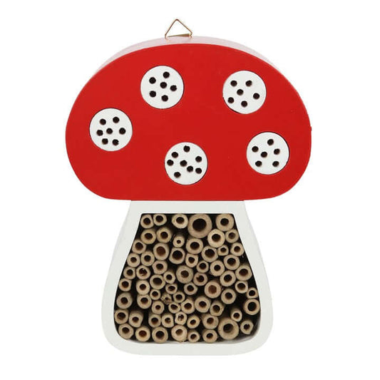 Mushroom-shaped bird seed feeder with red cap and white spots on a white background