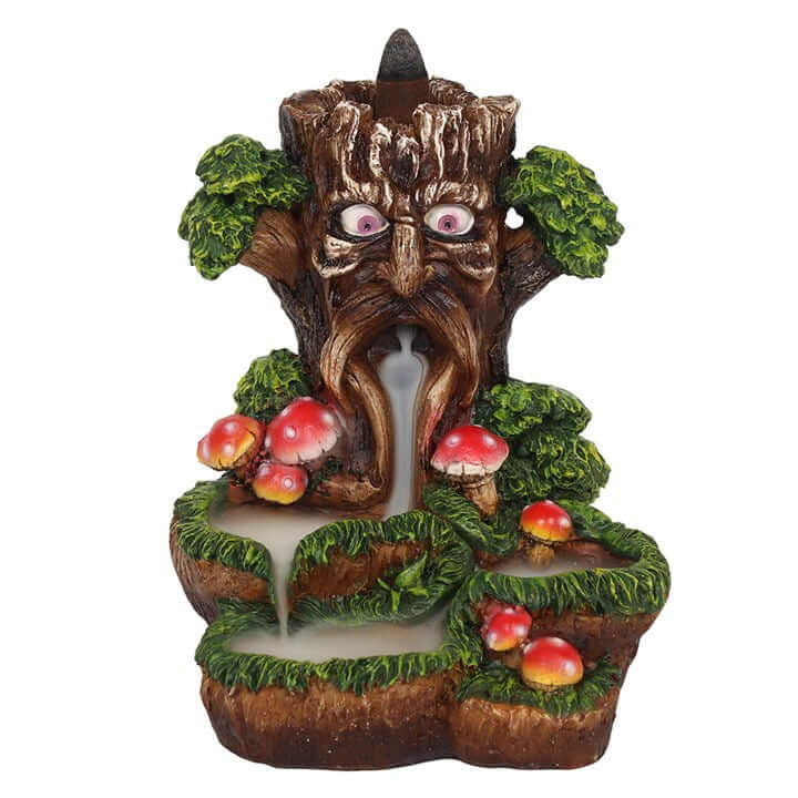 Decorative tree-like fountain with eyes and mushrooms on a white background