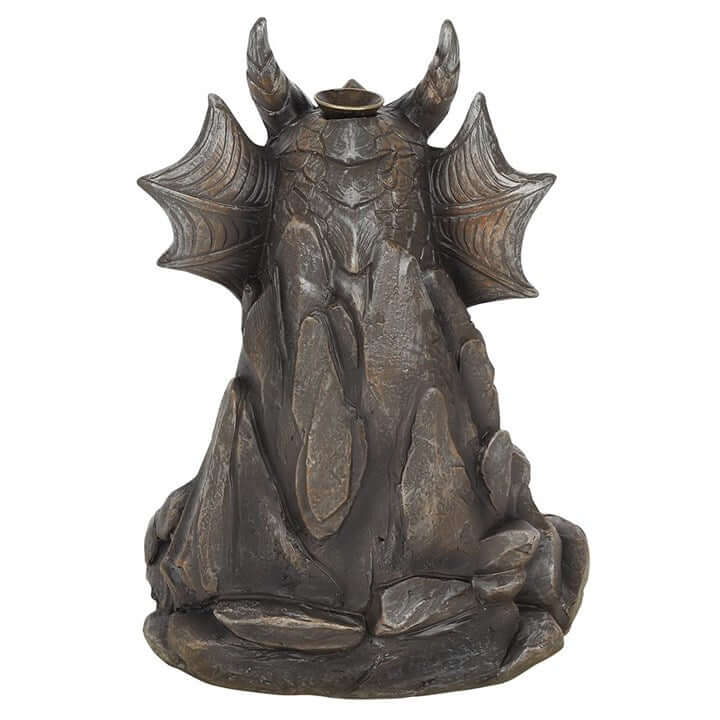 Decorative statue of a winged creature on a white background