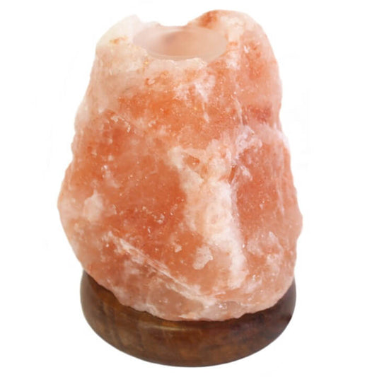 Himalayan salt lamp with wooden base on a white background