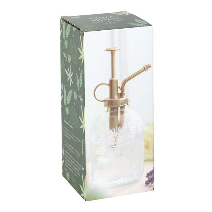 Glass spray bottle with brass nozzle in a decorative box