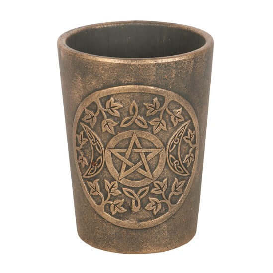 Ceramic cup with pentagram design on a white background