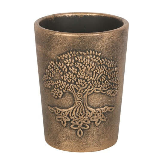 Bronze-colored tumbler with tree design on a white background
