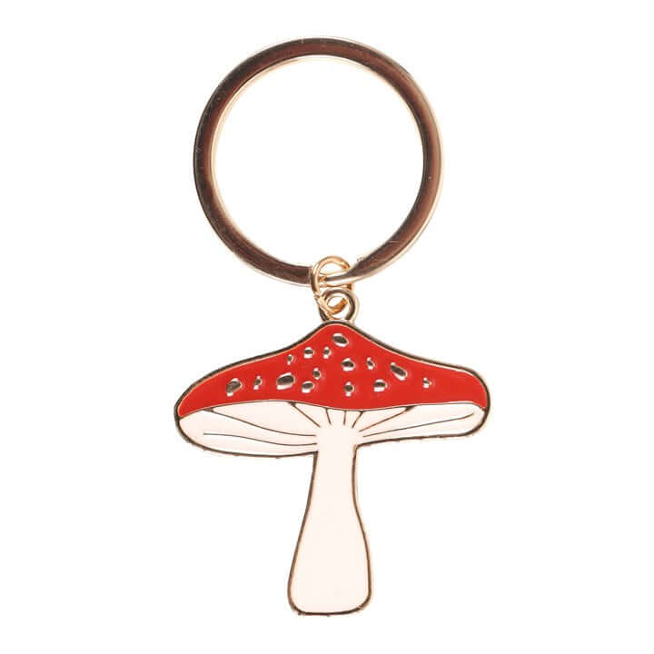 Mushroom-shaped keychain with red cap and white stem on a white background