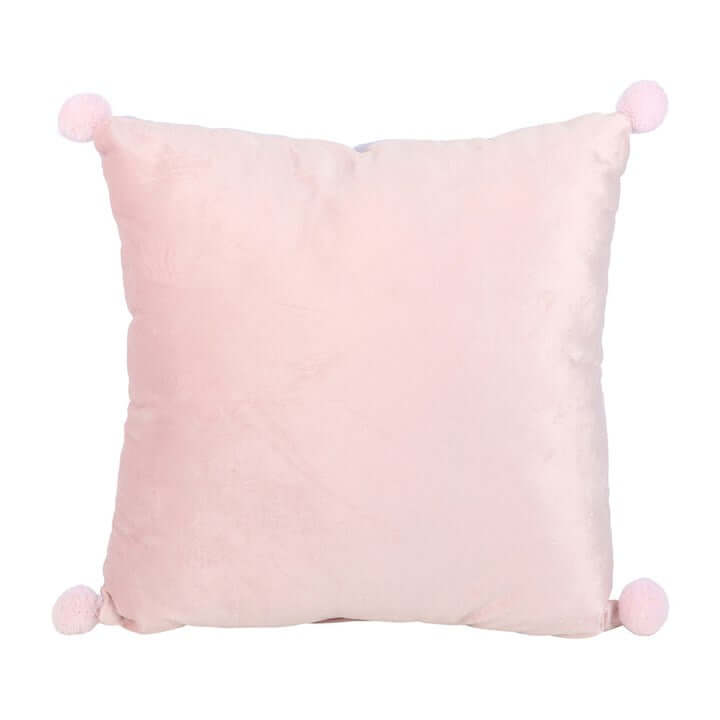 Pink pillow with pom-pom accents on a white background