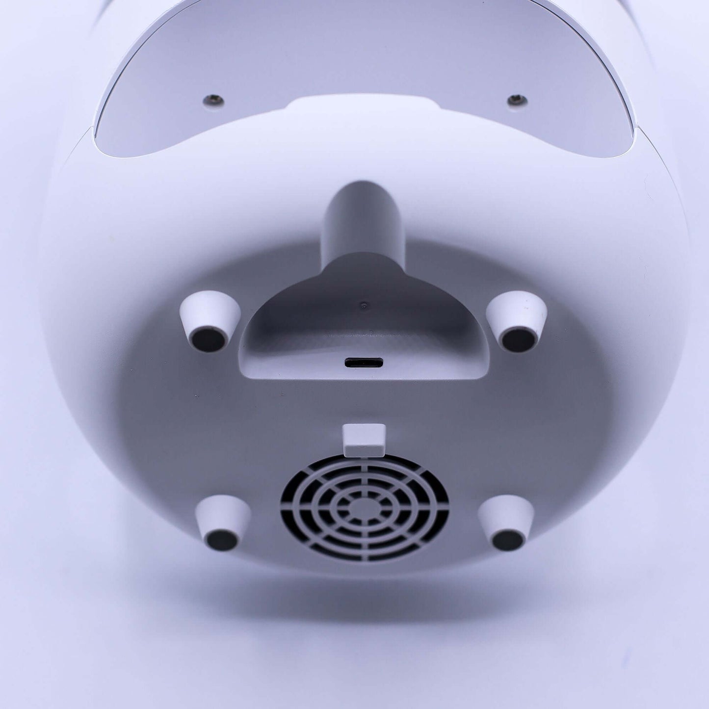 Bottom view of a white Aroma Diffuser showcasing details like air vents, ports, and sleek design.