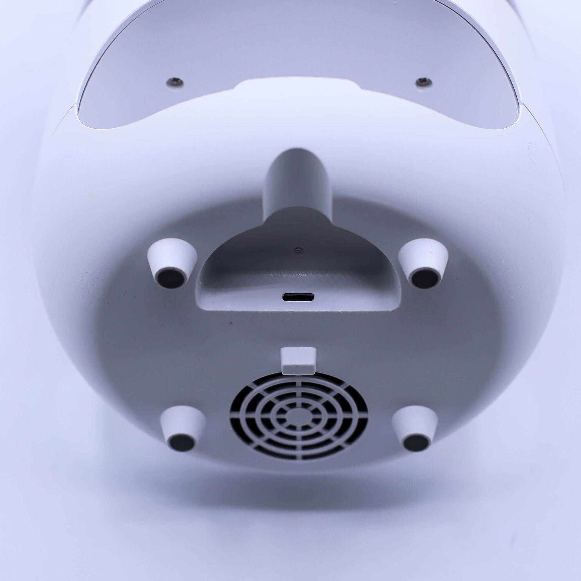 Bottom view of a white Aroma Diffuser showcasing details like air vents, ports, and sleek design.