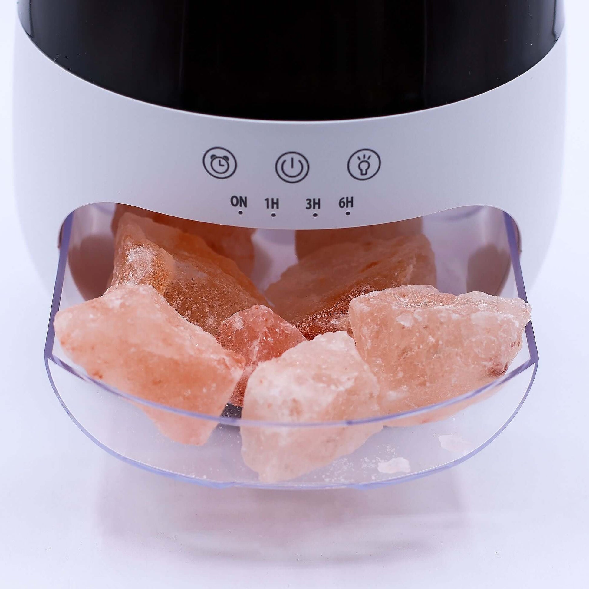 Aroma Diffuser with pink salt stones in a clear tray, showcasing the elegant design and soothing aromatherapy features.