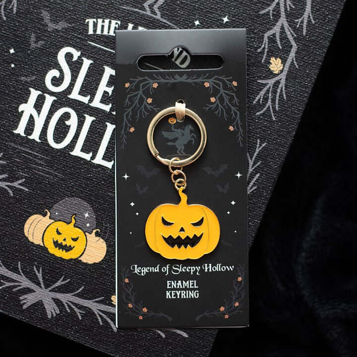 The Legend of Sleepy Hollow Pumpkin Keyring featuring a mischievous carved pumpkin design on a display card.