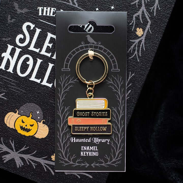 The Haunted Library Book Stack Keyring featuring spooky book titles like Ghost Stories and Sleepy Hollow.
