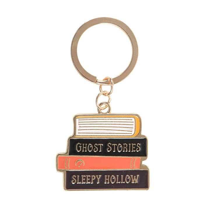 The Haunted Library Book Stack Keyring featuring Ghost Stories and Sleepy Hollow titles.